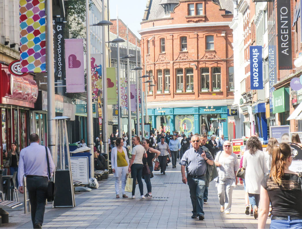 BELFAST, NORTHERN IRELAND- MAY, 2018: Many people walking in Belfast city centre high street shopping area 