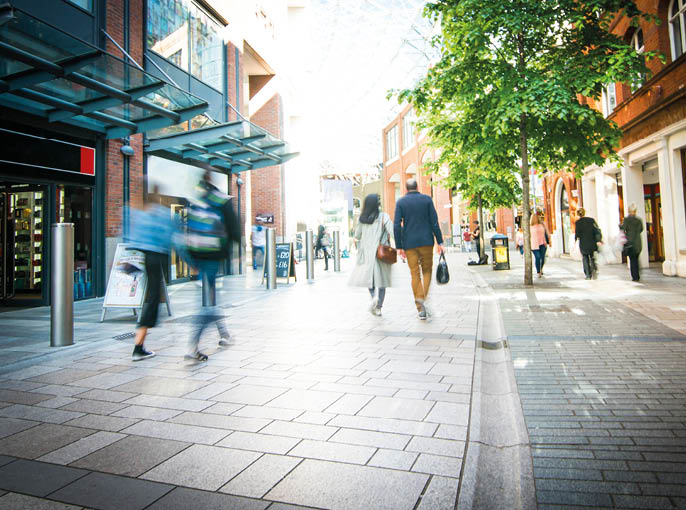 Anonymous shoppers walking on a shopping high street