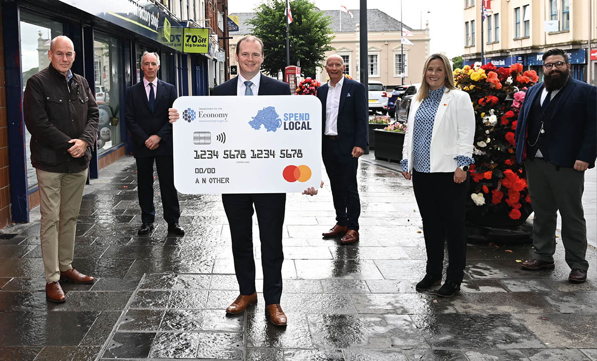 Minister for the Economy Gordon Lyons with Lee Britton (CEO Europe at PFS ), Roger Pollen (Head of FSB NI), Glyn Robert (Retail NI Chief Executive)  Sarah Cunningham (Vice President at Mastercard)  and Aodhan Connolly (Director , Northern Ireland Retail Consortium) at the announcement of the High Street Scheme in Carrickfergus on Thursday 