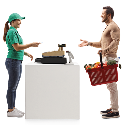 Full length profile shot of a guy paying at a cash register with a shopping basket isolated on white background