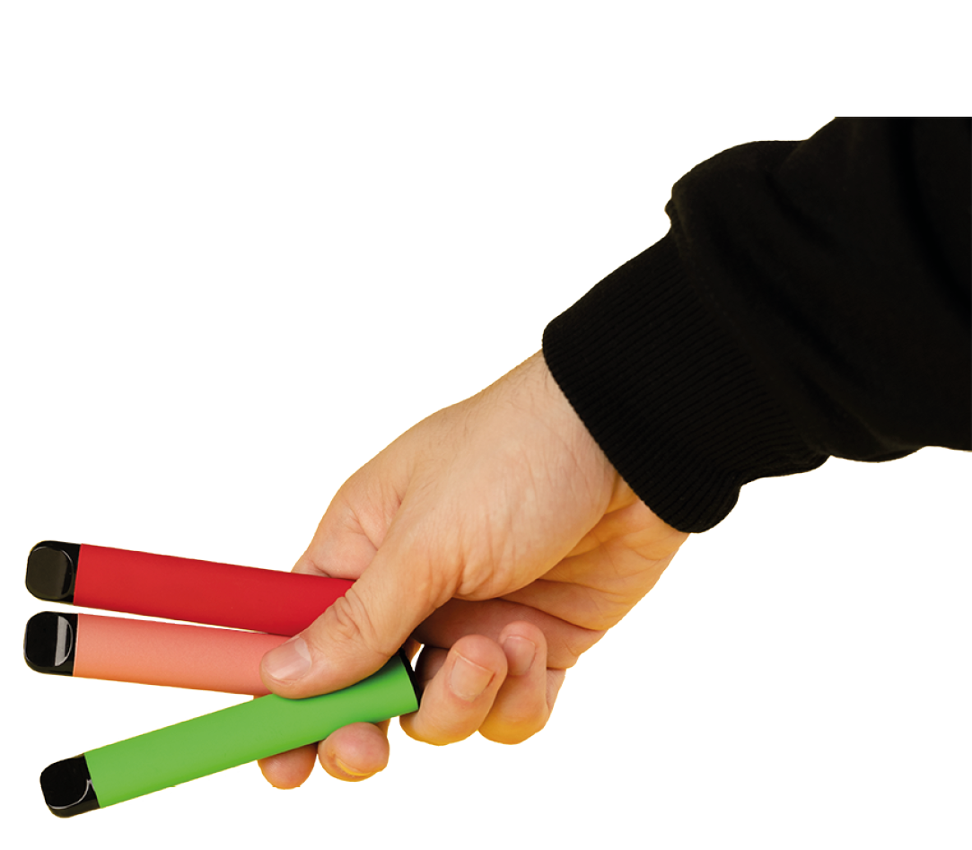 Disposable electronic cigarettes of different flavors in hand on a yellow background  The concept of modern smoking, vaping and nicotine 