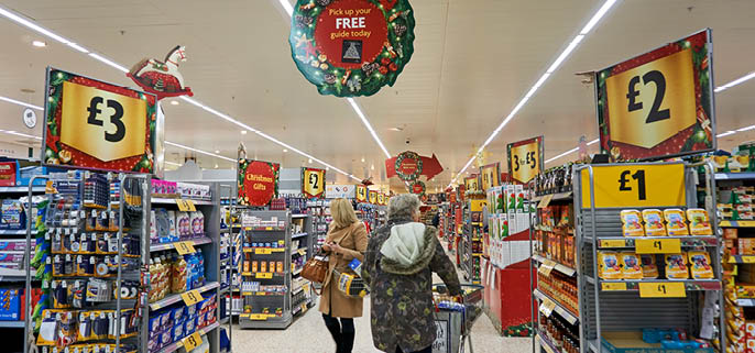 LIVINGSTON, SCOTLAND, UK - DECEMBER 6, 2016. Customers are shopping at Morrisons Supermarket during busy Christmas / New Year shopping time.