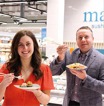 Marks & Spencer has unveiled its transformed Lisburn Foodhall at Sprucefield Shopping Complex, showcasing a brand-new look and shopping experience for customers    Bringing 30 jobs to the local area, M&S Lisburn is only the second store in Northern Ireland to receive this comprehensive renewal programme, with the addition of new and exciting in-store features   The new look store is easier to shop with lots of amazing features including a brand new Mai Sushi counter with freshly prepared sashimi and sushi  Pictured taste testing some of the sushi is JP McShane, M&S Lisburn Store Manager and Lynsey Weir, Store Liaison Manager 