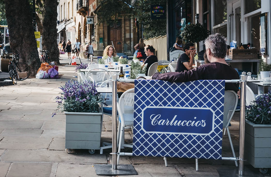 London, UK - August 1, 2018: People sitting at outdoor tables of Carluccio's restaurant in Hampstead, an affluent area favoured by academics, artists and media figures 