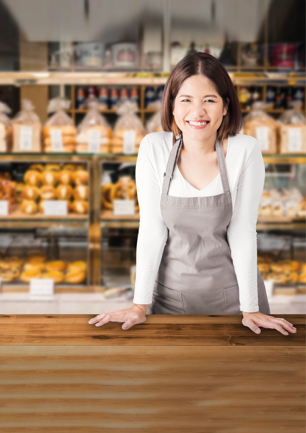 business owner with bakery shop background