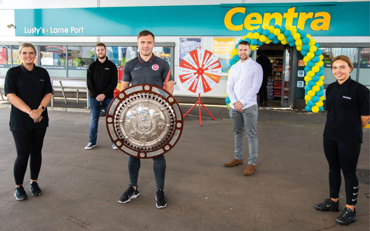 Pictured at the opening of Lusty s Centra Larne Port are Larne footballer Graham Kelly (centre) and owner Raymond Lusty (back right) with members of the store team 