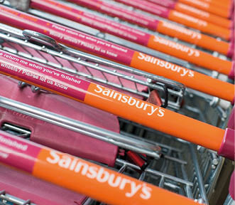 WORCESTER, UK - APRIL 2017: Sainsbury's supermarket trolleys stacked in a line 