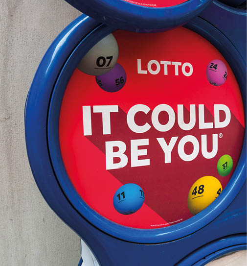 London, UK, July 3rd 2021: A close-up of a shops Lotto display stand  Advertising to play the UK lottery games  It could be you 