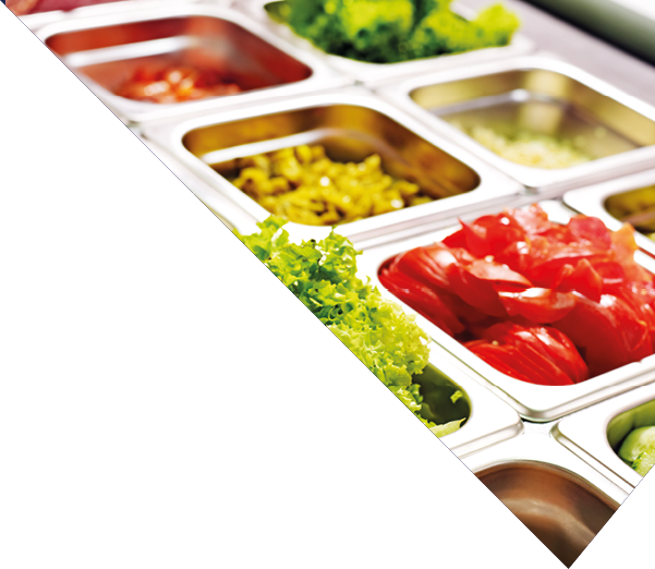 Tray with cooked food on showcase at cafeteria 