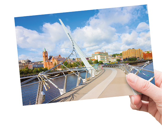Urban skyline of DERRY city, also called LONDONDERRY, in northern IRELAND with the famous PEACE BRIDGE - Europe - Northern Ireland - concept image