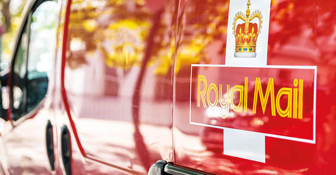 London, UK - September 13, 2018: Red Royal Mail delivery van truck car on street road in city in Pimlico