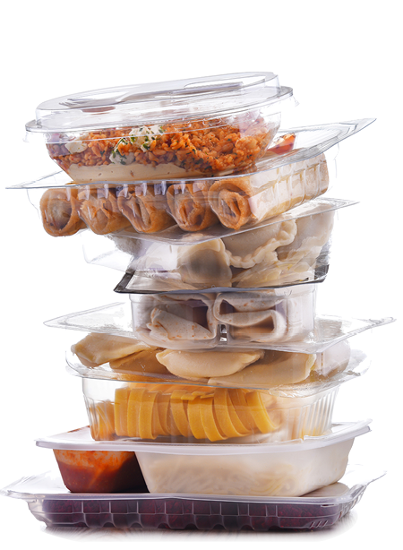 A variety of prepackaged food products in plastic boxes.