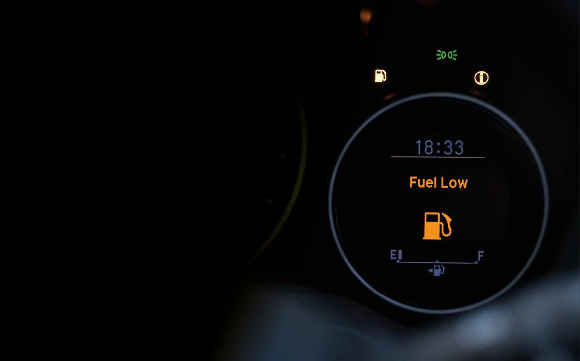 Close up empty Petrol, gasoline gauge dash board in car with digital warning sign of run out of fuel turn on on black background  Low level of fuel show on speedometer dashboard 