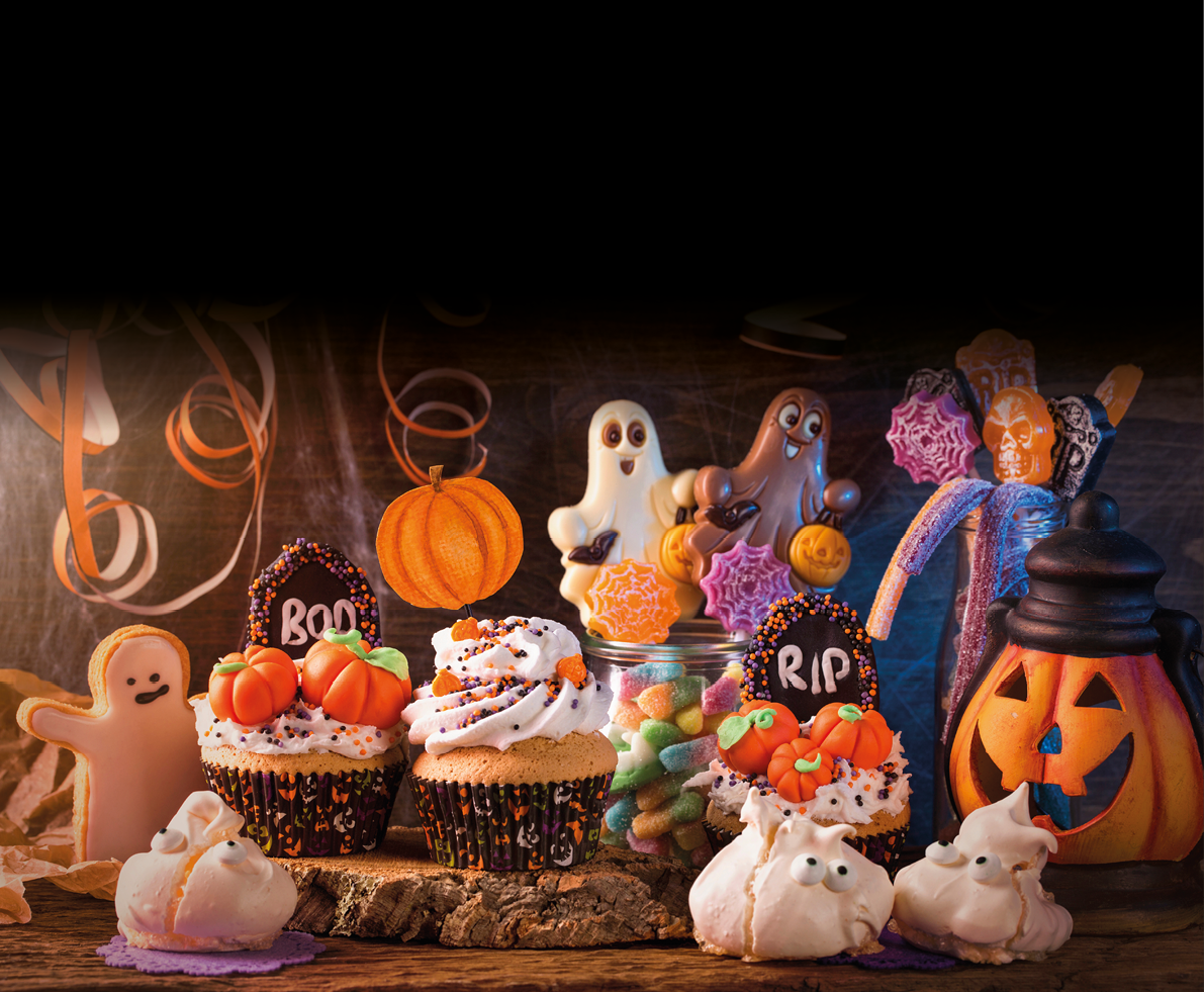 Sweets for halloween party on a wooden background