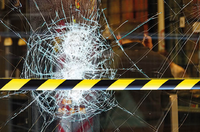 Shop windows broken during the demonstration protest against The Government and COVID-19 Restrictions  Turin, Italy - October 2020