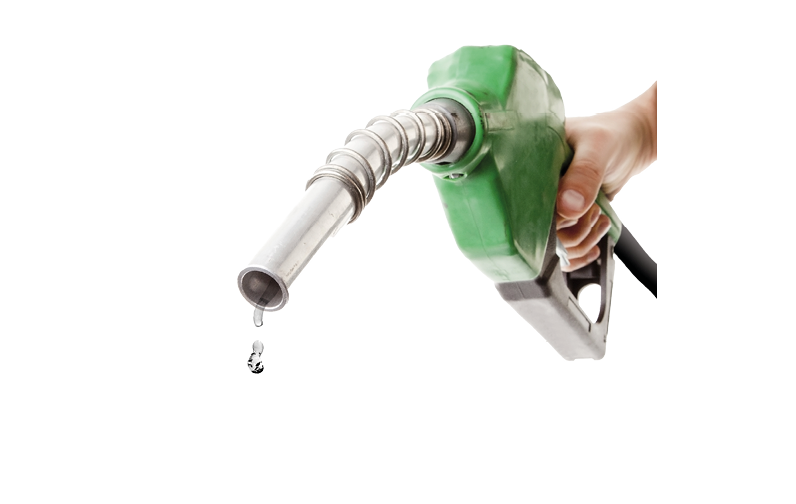 Male hand holding gas pump isolated on white with one last drop of fossil fuel