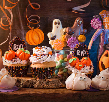 Sweets for halloween party on a wooden background