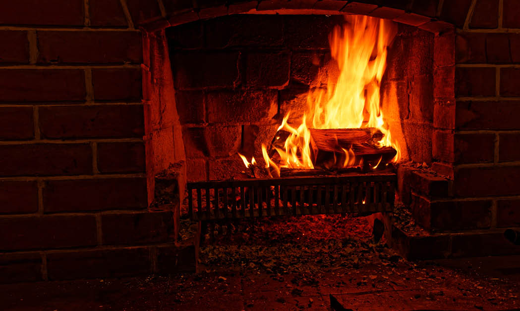 Winter warmth, an open fire burns brightly