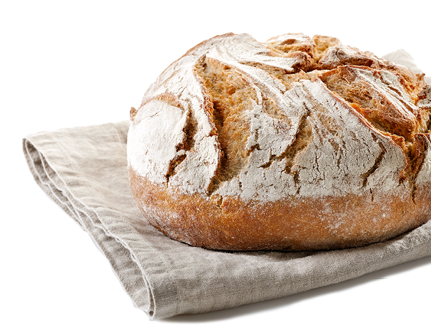freshly baked bread on linen towel isolated on white background