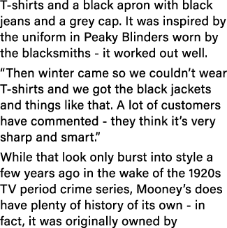 T-shirts and a black apron with black jeans and a grey cap  It was inspired by the uniform in Peaky Blinders worn by    