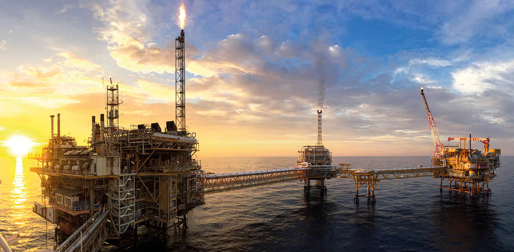 Panorama view of offshore oil and Gas processing platform in sunset time, Concept of exploration and petroleum production industry in the sea 