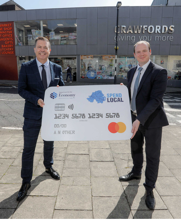 Economy Minister Gordon Lyons (r) and Glyn Robert, Retail NI, pictured in Maghera  Registration for the High Street Scheme Spend Local card will be open from 27 September until 25 October     Picture: Philip Magowan   Press Eye