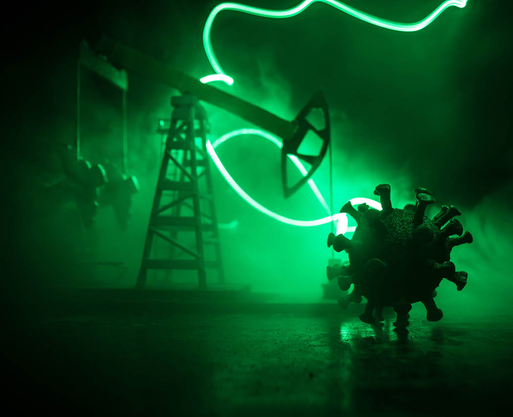 Oil industry crisis concept  Oil stock crisis because Covid global pandemic  Oil pump and oil refining factory at night with fog and backlight  Creative artwork decoration  Selective focus 