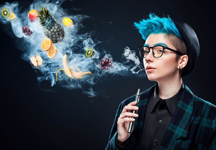 hipster woman with blue hair smoking fruit electronic cigarette on black background  Vape advertisement concept  Copy space