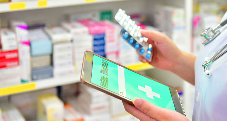 Pharmacist holding capsule pack and touch pad for search bar on display in pharmacy drugstore shelves background Online medical concept 