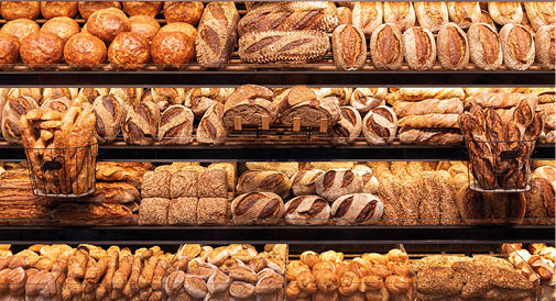 Delicious loaves of bread in a german baker shop  Different types of bread loaves on bakery shelves 