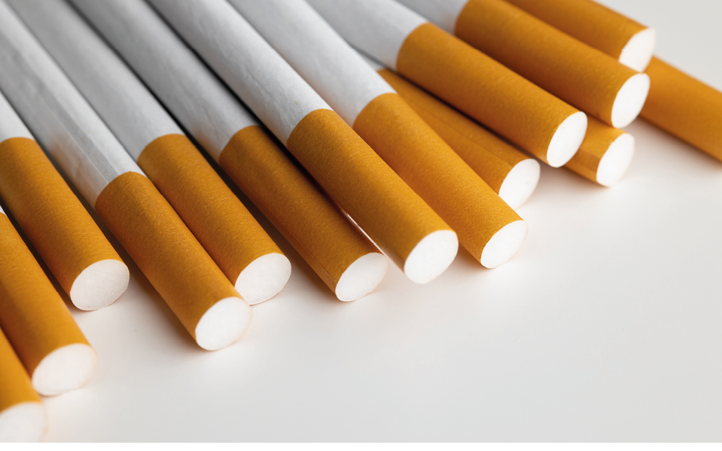 Many cigarettes stacked together. Drugs are harmful to the respiratory system.