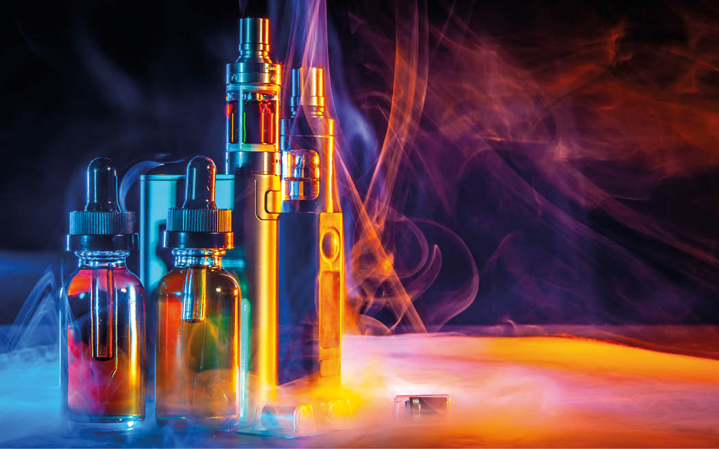 VAPE Electronic Cigarette. Liquid for VAPE. Steam from an electronic cigarette. VAPE concept