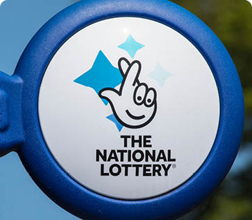 ARUNDEL, UK - May 5th 2018: Close-up of The National lottery Sign, on display outside a newsagents in the town of Arundel in West Sussex, on 5th May 2018.