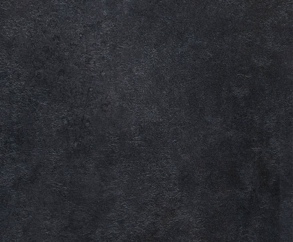 Radamer cheese on a black concrete background. View from above.