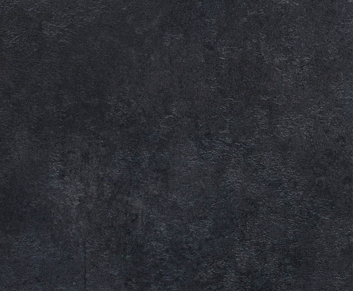 Radamer cheese on a black concrete background. View from above.