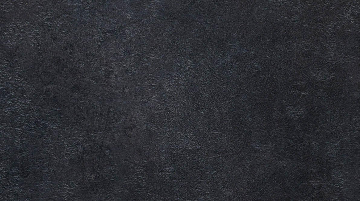 Radamer cheese on a black concrete background. View from above.