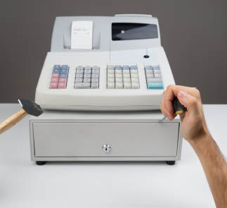 Close-up Of Person Hands Trying To Open Cash Register Drawer With Worktool