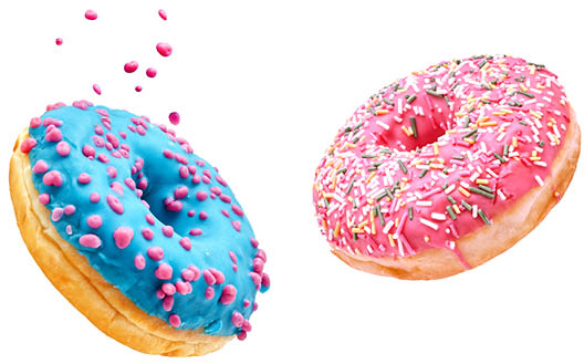 Fresh sweet donuts in motion with multicolored fruit glaze and sprinkles decorated. Fast sweet food concept, bakery ad design elements with glazed frosted falling doughnuts isolated, white background