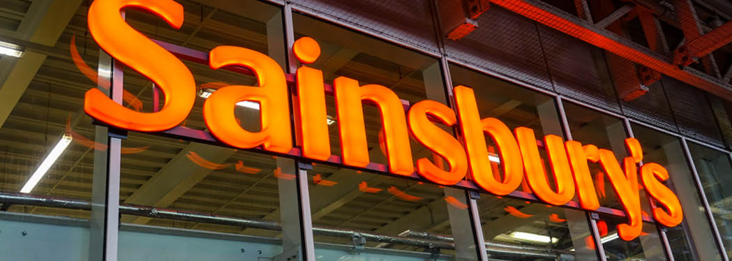London UK, May 9th 2021: The large orange Sainsbury's supermarket logo sign above the main entrance. Whitechapel, East London branch. Cost of living, inflation, price rise and food shortages. 