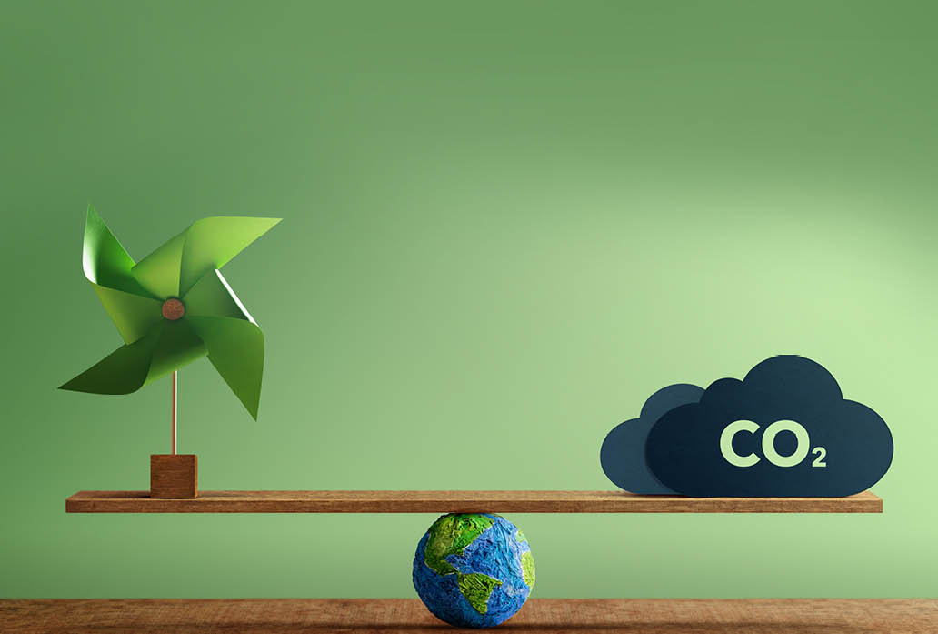 Carbon Neutral and ESG Concepts. Carbon Emission, Clean Energy. Globe Balancing between a Wind Turbine and CO2. Sustainable Resources, Environmental Care. Making a Wind Energy