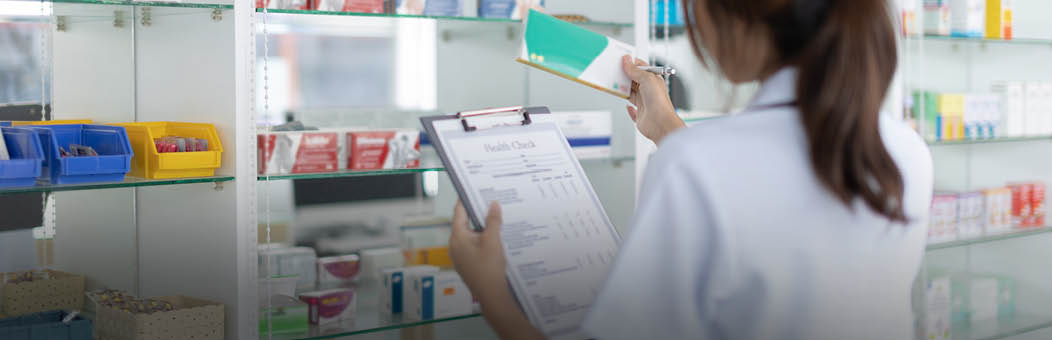 Pharmacist women are supplying prescription drugs to customers, Pharmacists work in a pharmacy, Drug store shelf with prescription medication, Clipboard at the hospital pharmacy, Community Pharmacy.