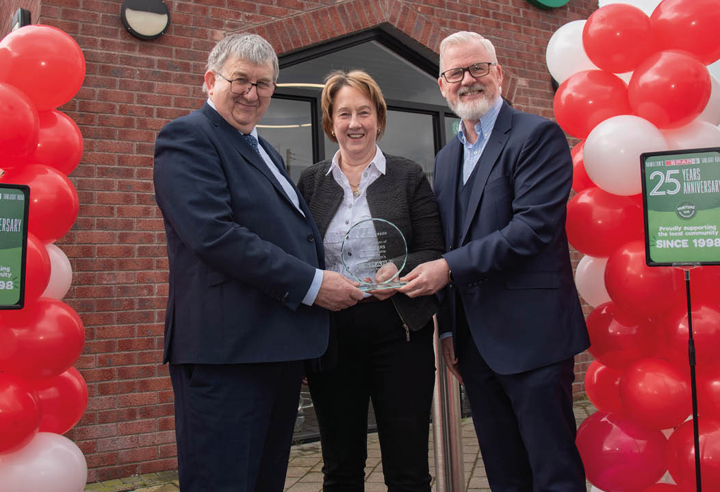 Sales and Marketing Director Paddy Doody presents Charlie and Ruth Hamilton with a specially commissioned engraved piece to make their 25 year anniversary.