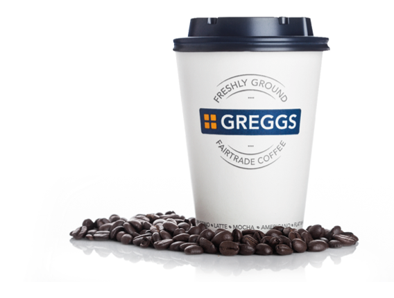 LONDON, UK - APRIL 15, 2019: Closeup of Greggs fairtrade paper coffee cup and sign with lid on white.
