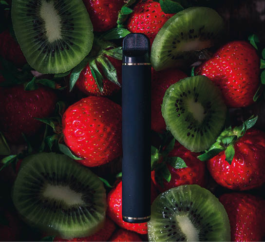 Disposable electronic cigarettes of different flavors over different fruits on the background. The concept of modern smoking, vaping and nicotine.