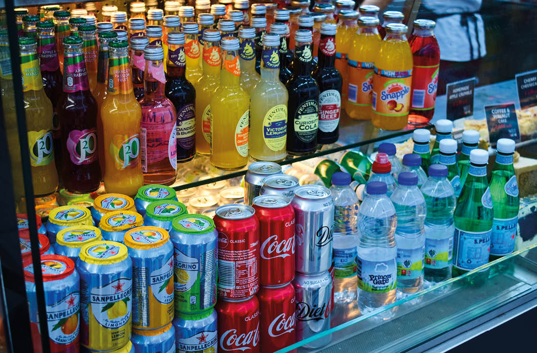 Milton Keynes, UK - 20 August 2018: Soft drinks on display at a fast food deli counter.