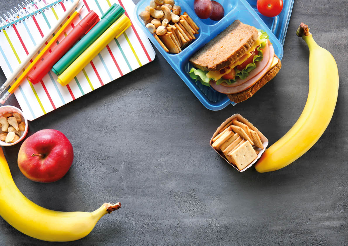 School lunch and stationery on table