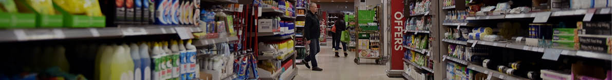Bath, UK - February 10, 2016: People shop in an aisle in a Waitrose supermarket. Founded in 1904 Waitrose is the food retail division of the John Lewis, Britain's largest employee owned retailer.