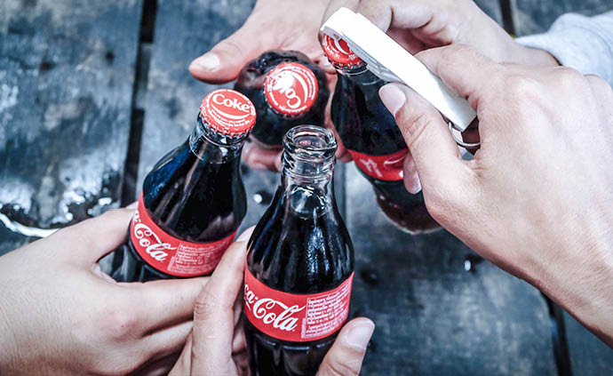 Group of young people drinking coke at a party  Coca Cola bottle Thailand, 5 May 2018