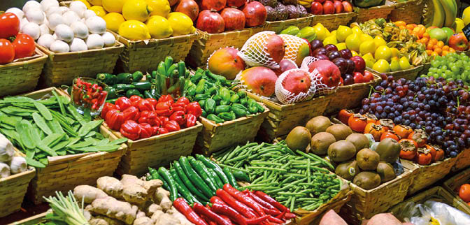 Fruit market with various colorful fresh fruits and vegetables