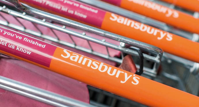 WORCESTER, UK - APRIL 2017: Sainsbury's supermarket trolleys stacked in a line 